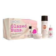 Le kit « Glazed Buns » de FRANK BODY, comprenant une crème pour le corps, un gel pour le corps, des gouttes pour les fesses, une trousse de toilette rose et un coffret cadeau