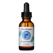Óleo facial antioxidante MAD HIPPIE num frasco de vidro castanho com pipeta preta, sobre um fundo branco