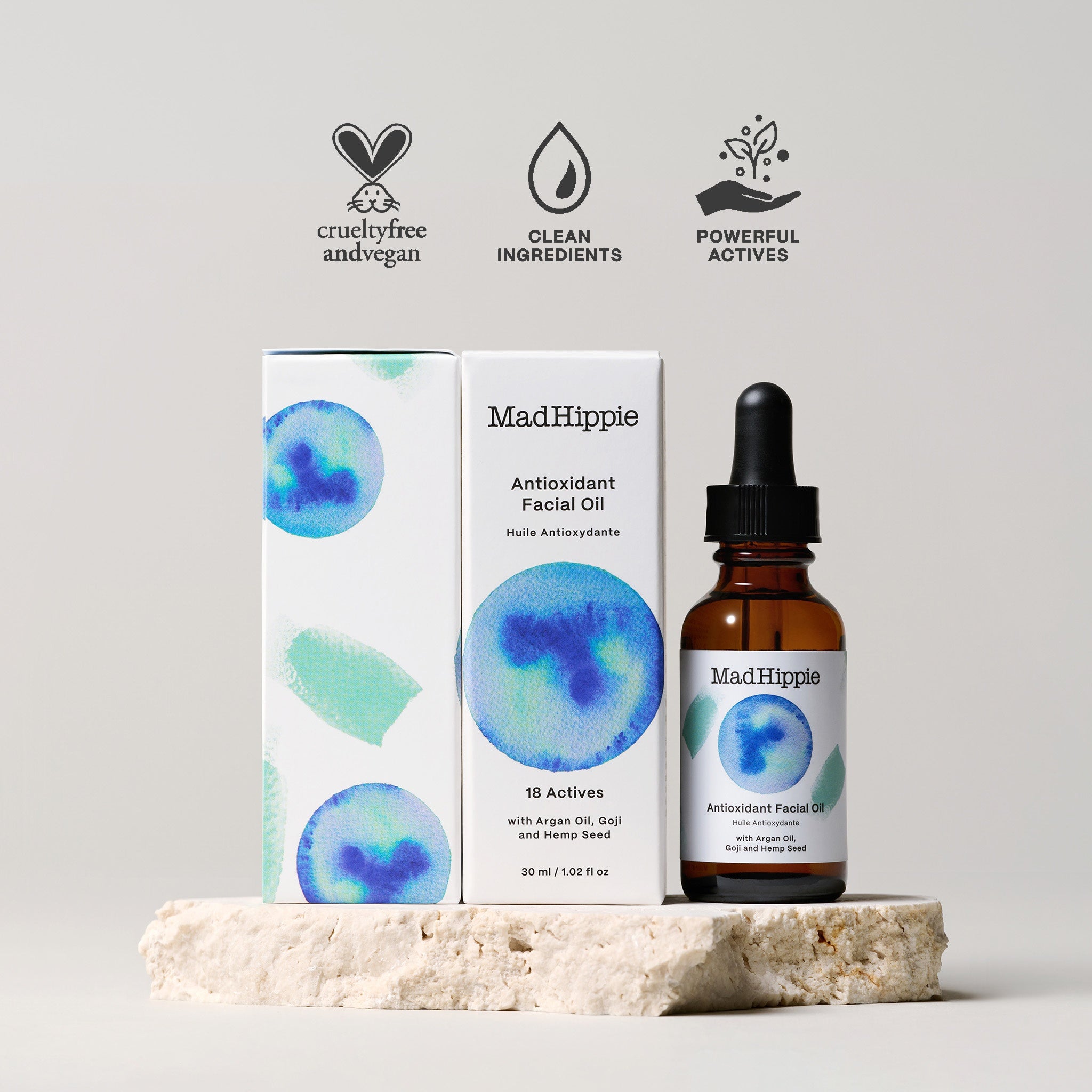 MAD HIPPIE Antioxidant Facial Oil – Óleo facial com astaxantina, frasco de 30 ml e embalagem sobre um suporte de pedra