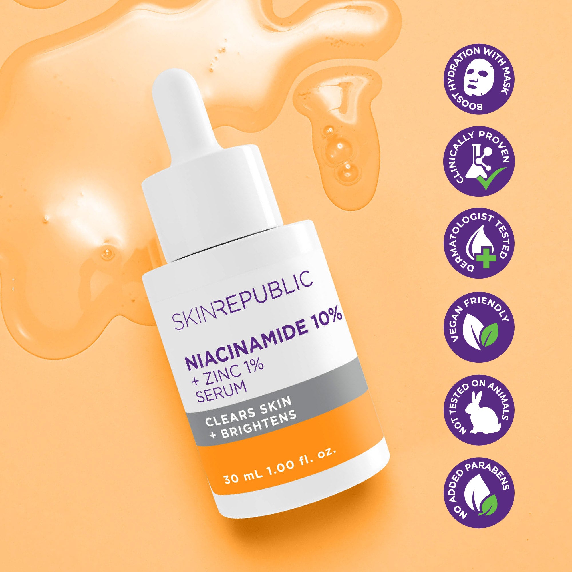 Eine Flasche Skin Republic Niacinamid Serum mit Pipette liegt auf orangefarbenem Hintergrund mit Serumtropfen und veganen Symbolen.
